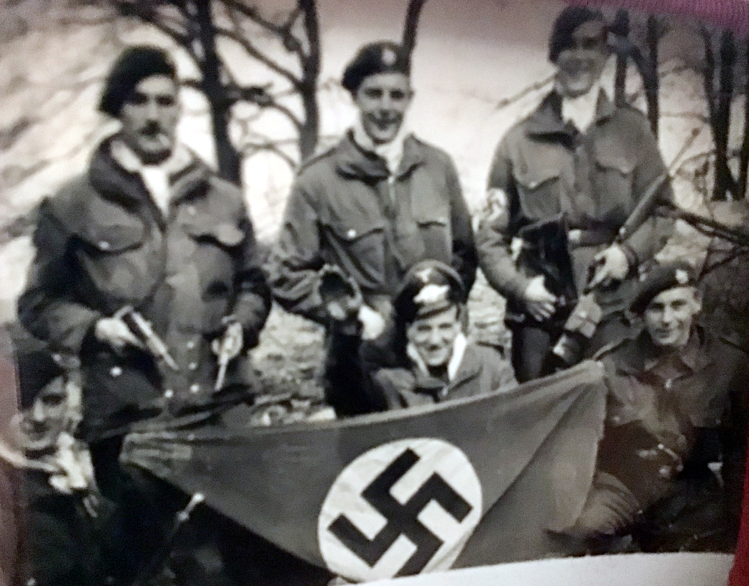 Royal Marine, John Perry and others mocking the enemy with captured flag and uniforms!