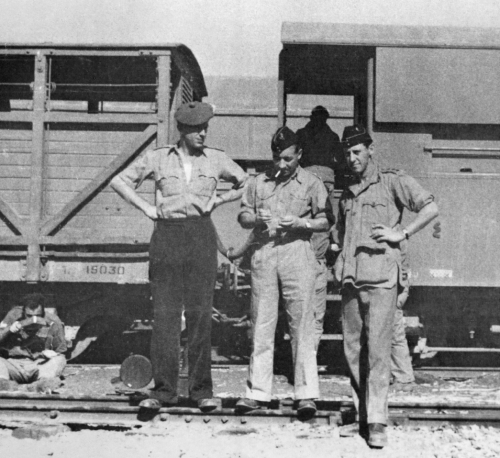 Personnel of 52 (Middle East) Commando en route, by train, to Gadaref. From left to right: John Milman (HLI), the second in Command, George Young (RE), the Commanding Officer and Bill Seymour (Scots Guards) the Adjutant.