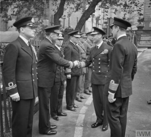HM The King paYing a private visit to COHQ on 29th September 1942 to meet officers. He was received by Lord Louis Mountbatten.